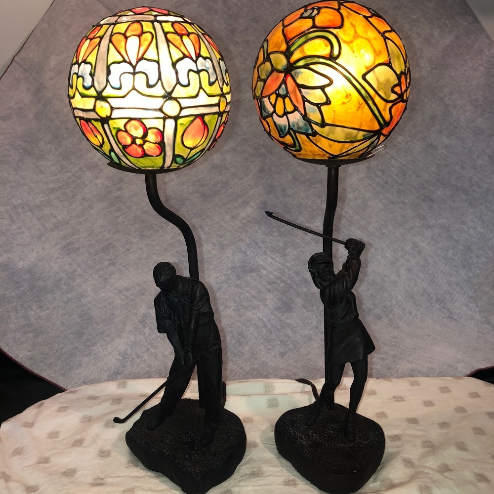 Lady and Man golfers in resin with bronze look lamps.